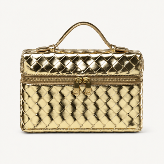 Gold structured woven top-handle bag with gold-tone hardware on white background